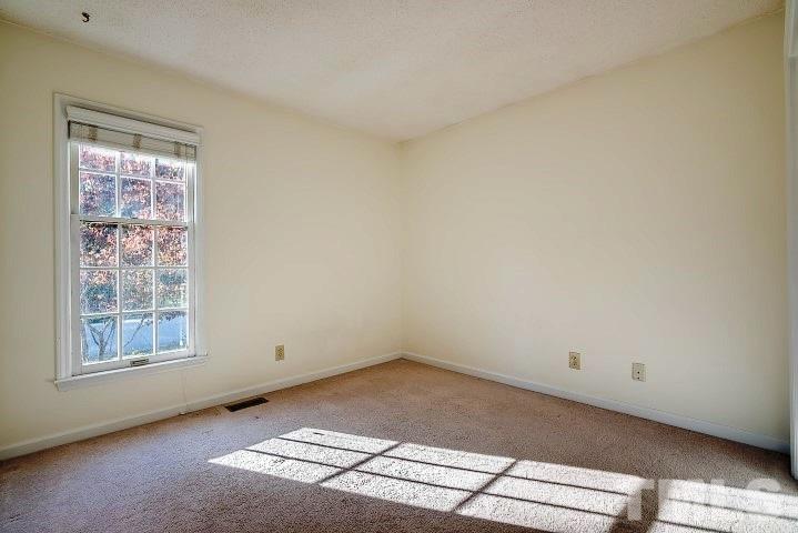 3913 Olde Coach Road Durham, NC 27707 - Photo 12 of 17 an empty room with windows