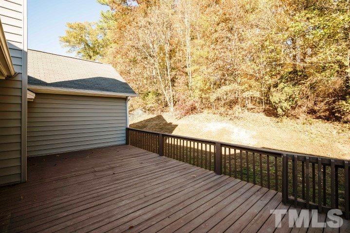 3913 Olde Coach Road Durham, NC 27707 - Photo 15 of 17 a terrace view with wooden floor and fence