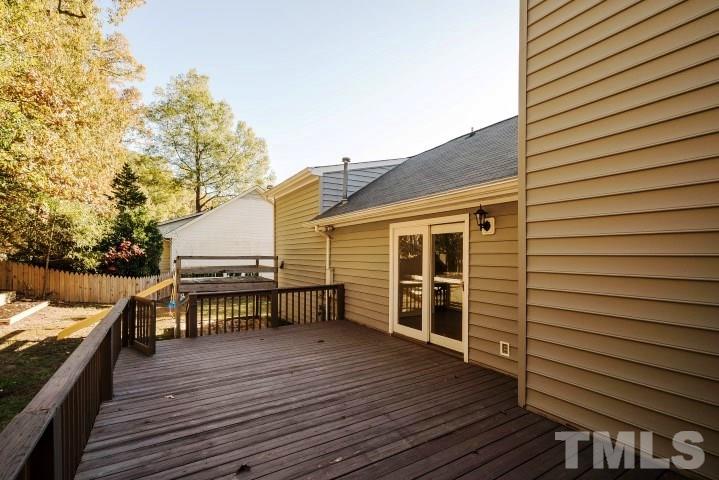 3913 Olde Coach Road Durham, NC 27707 - Photo 16 of 17 a view of a roof deck with wooden floor and fence