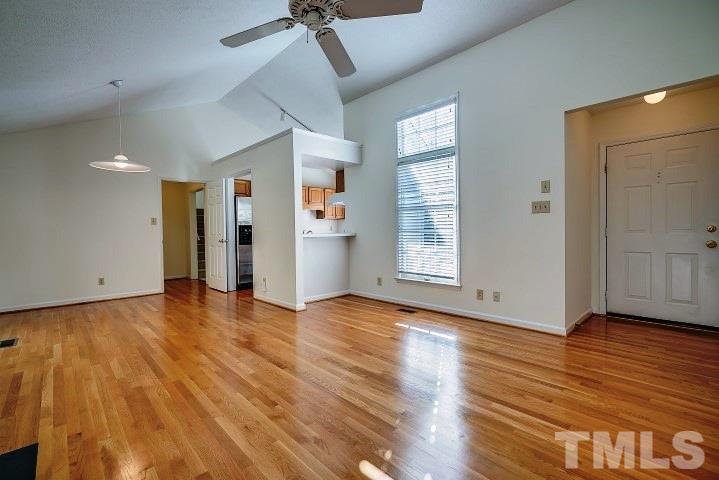 3913 Olde Coach Road Durham, NC 27707 - Photo 4 of 17 a view of empty room with wooden floor and fan