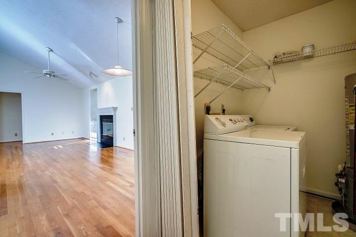 3913 Olde Coach Road Durham, NC 27707 - Photo 8 of 17 a view of a storage & utility room with washer and dryer