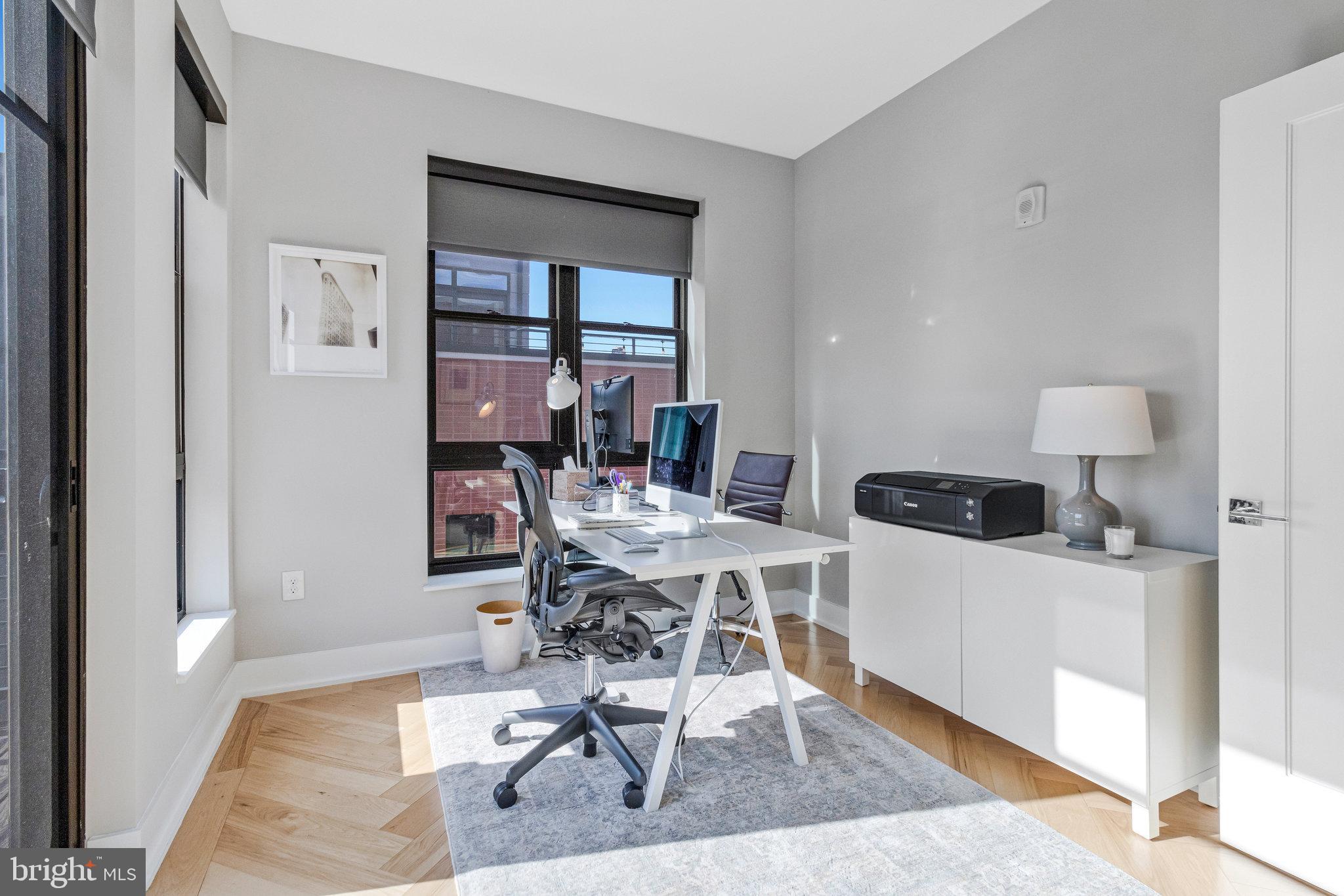 1345 K Street Southeast, Unit 406 Washington, DC 20003 - Photo 19 of 46 a workspace with furniture and wooden floor
