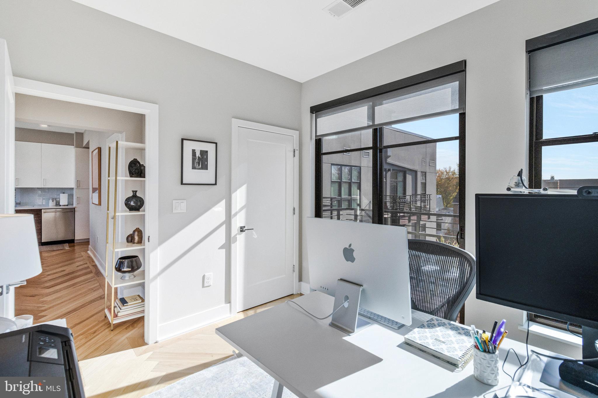 1345 K Street Southeast, Unit 406 Washington, DC 20003 - Photo 20 of 46 a living room with furniture and wooden floor