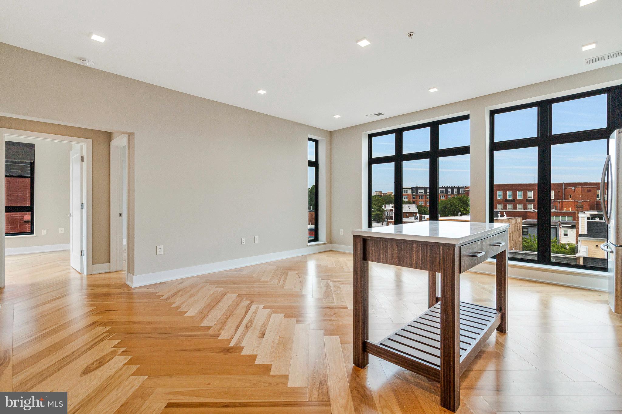 1345 K Street Southeast, Unit 406 Washington, DC 20003 - Photo 29 of 46 a dining room with furniture and large windows