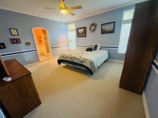 552 Bean Creek Road, Unit 94 Scotts Valley, CA 95066 - Photo 17 of 18 a bedroom with a bed and painting on the wall