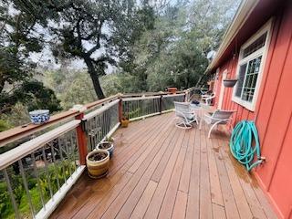 552 Bean Creek Road, Unit 94 Scotts Valley, CA 95066 - Photo 2 of 18 a view of deck with furniture and trees