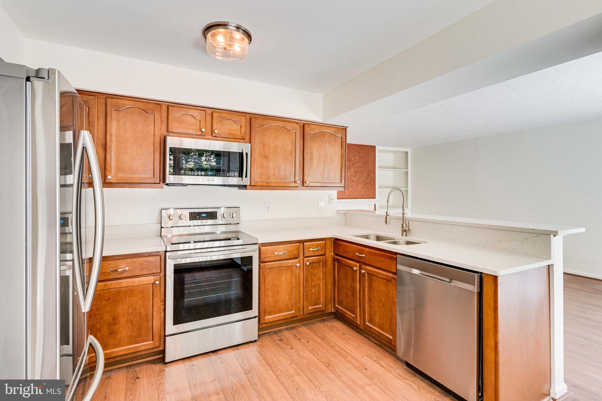 2403 Pondside Terrace Silver Spring, MD 20906 - Photo 14 of 45 Open kitchen, with SS appliances