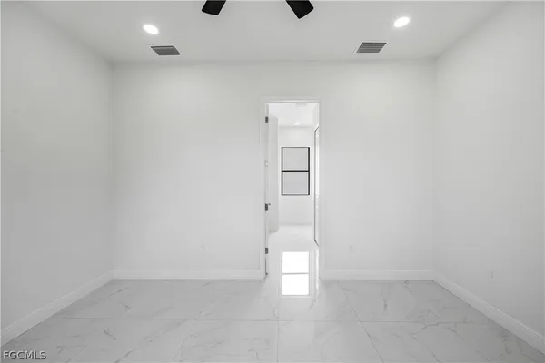 an empty room with white walls and white walls