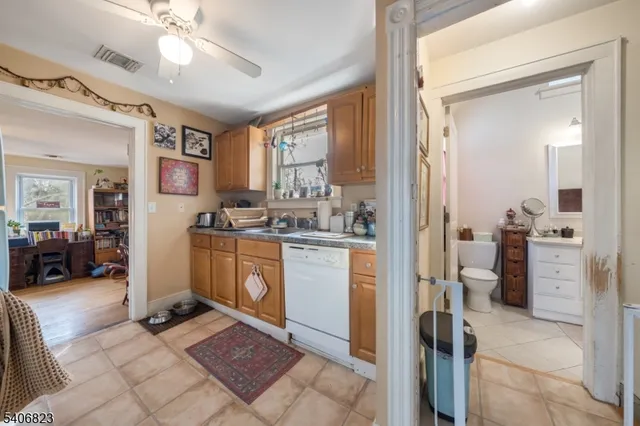 a kitchen with stainless steel appliances granite countertop a stove and a sink