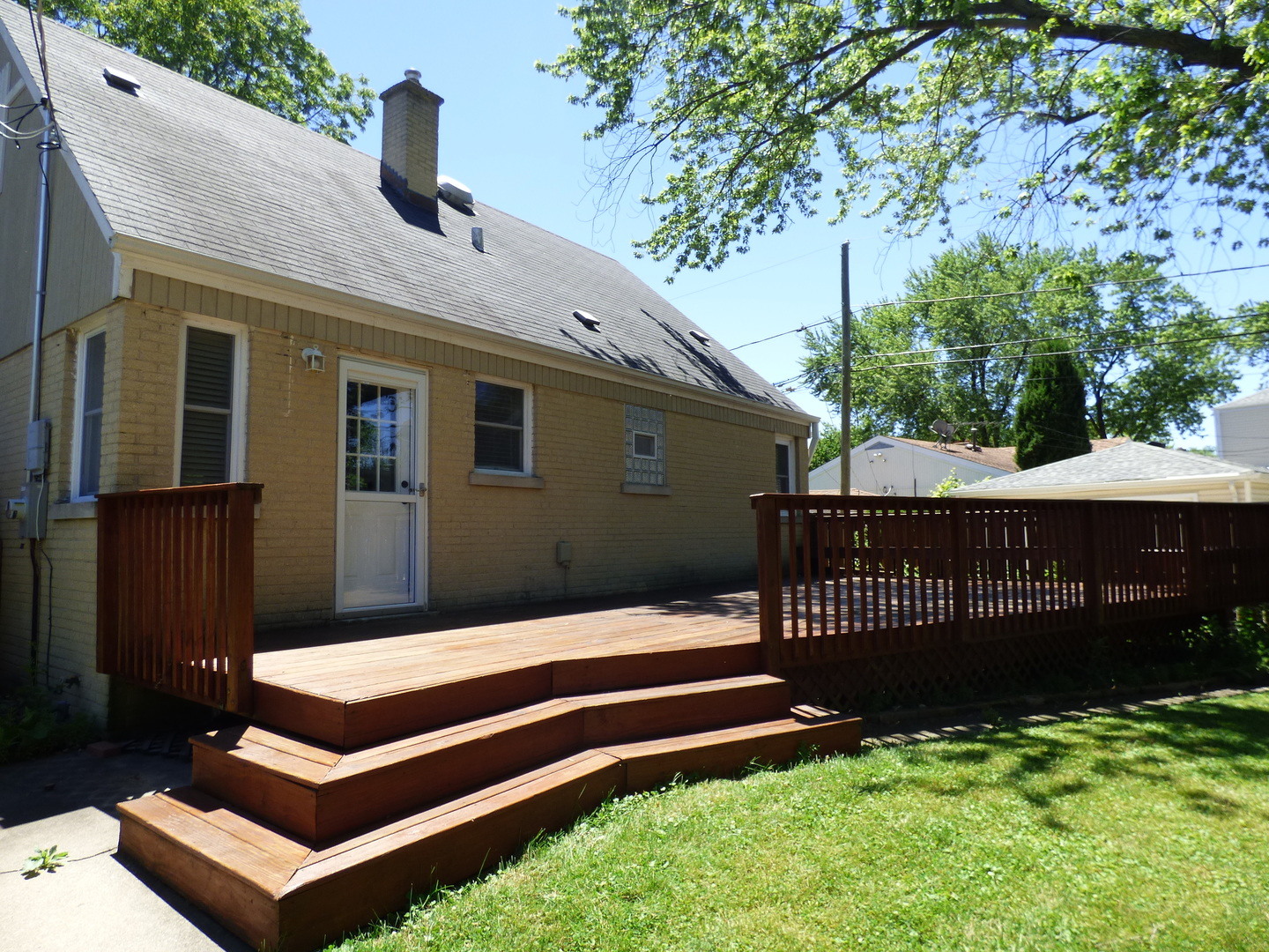 5416 Conrad Street Skokie, IL 60077 - Photo 14 of 14 a front view of a house with a garden