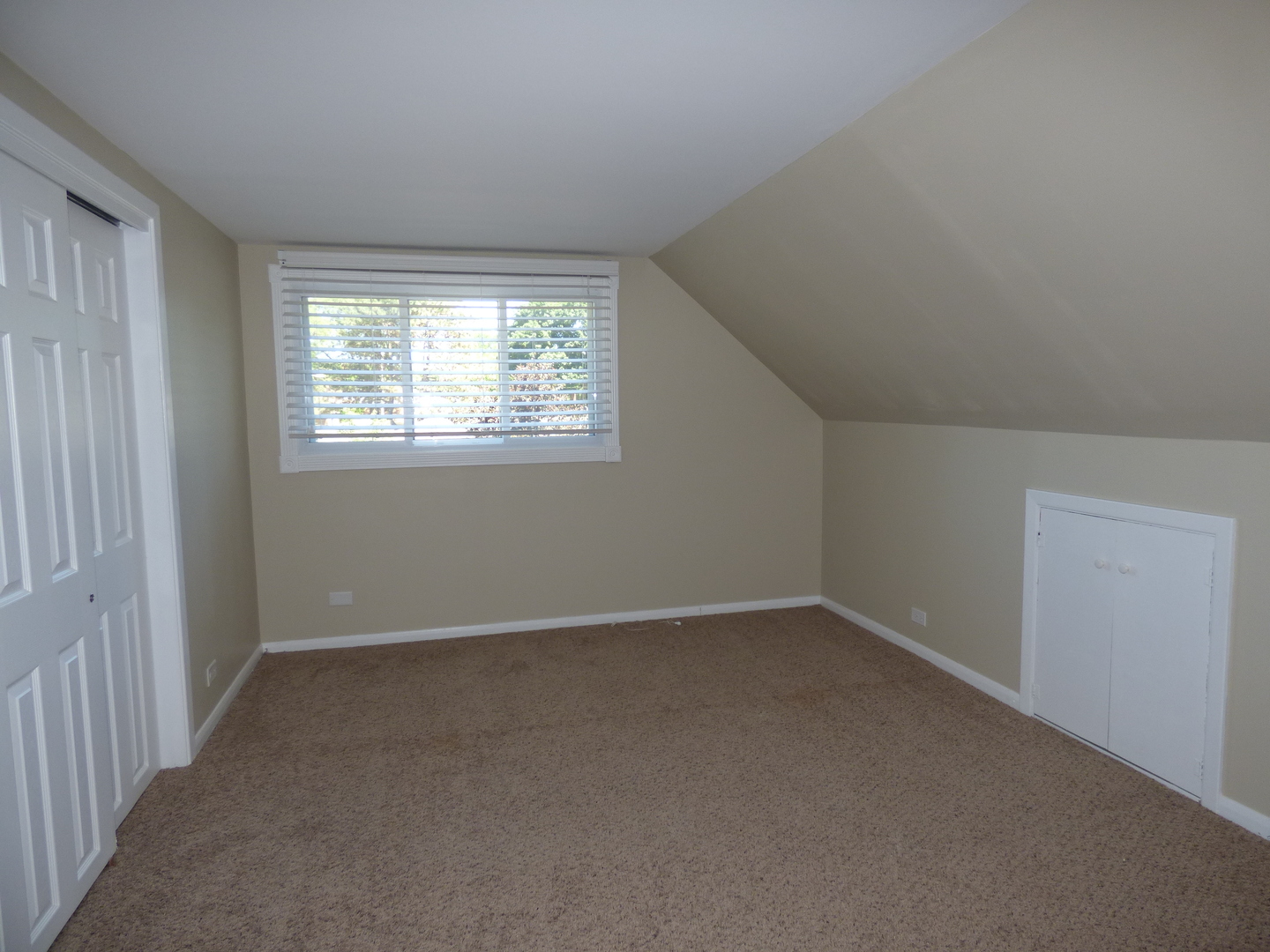 5416 Conrad Street Skokie, IL 60077 - Photo 10 of 14 an empty room with a window