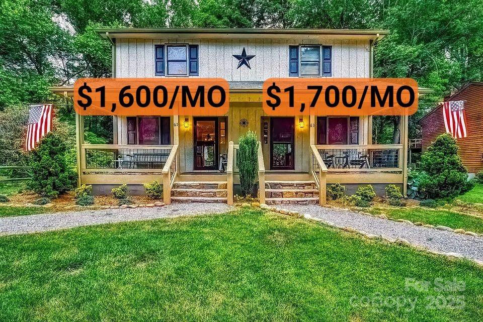 a front view of multi story residential apartment building with yard and outdoor seating
