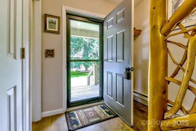 a view of an entryway with a door