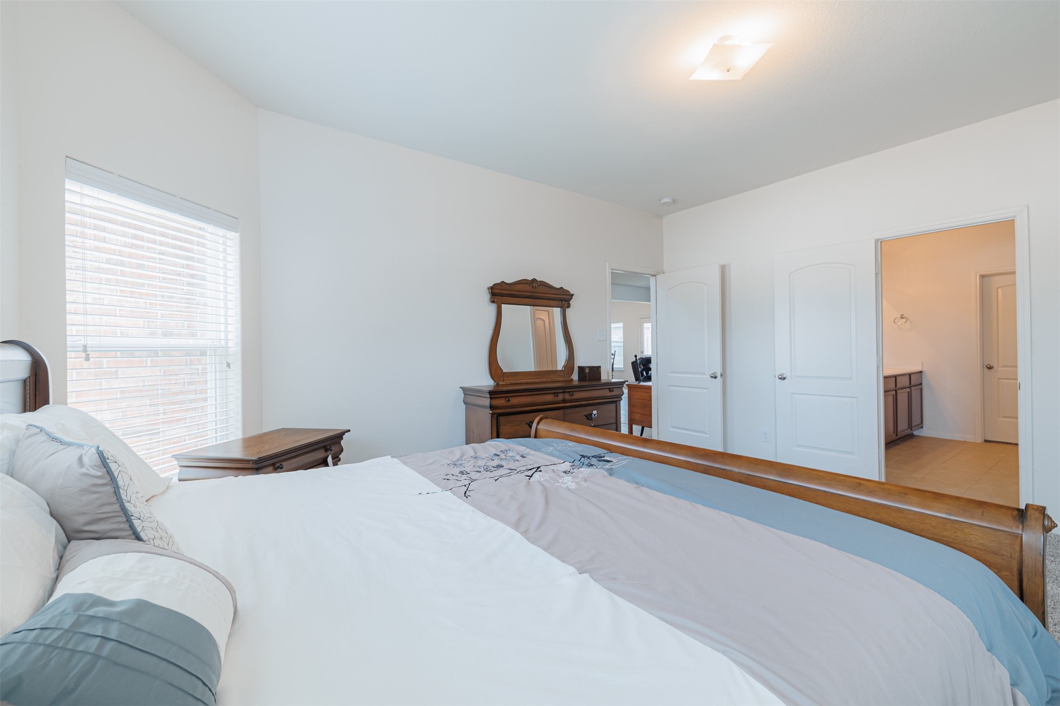 2511 Ocean Cove Circle Rosenberg, TX 77469 - Photo 15 of 25 Another view of the primary suite looking towards the ensuite bath.