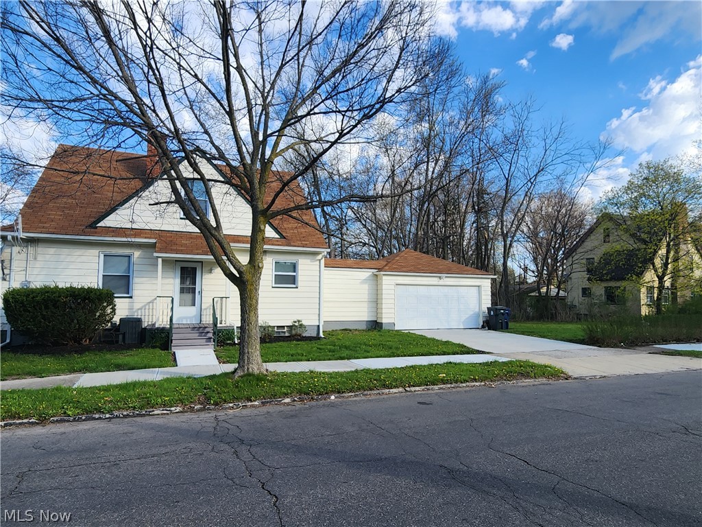 2199 North Taylor Road Cleveland Heights, OH 44112 - Photo 3 of 19 View of front of house with central AC and a front lawn