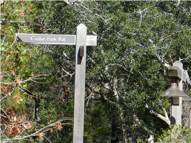 a street sign on a pole on a street