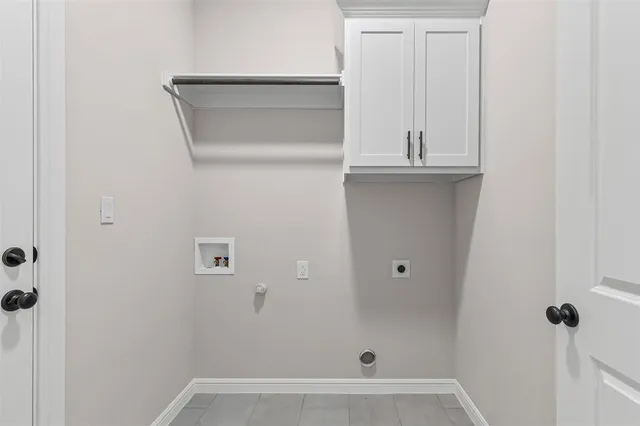 a view of a brick house with a yard