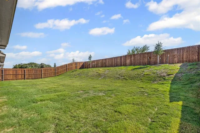 an aerial view of a house with a garden and plants