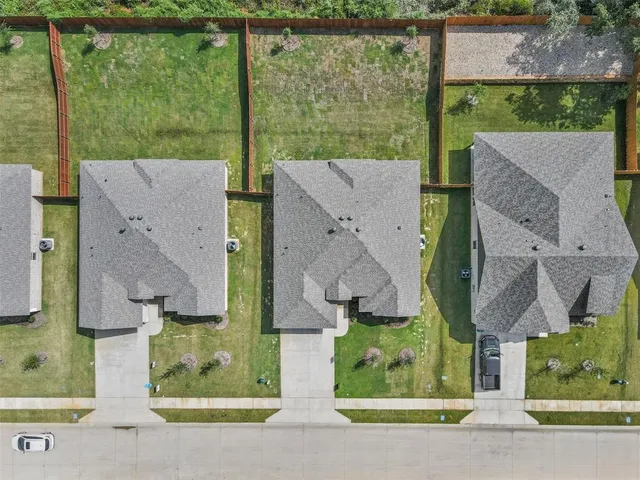 an aerial view of house with yard