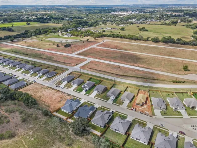 a view of small pool and a table