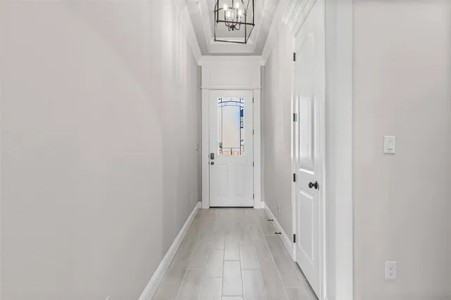 a living room with furniture a clock and a fireplace