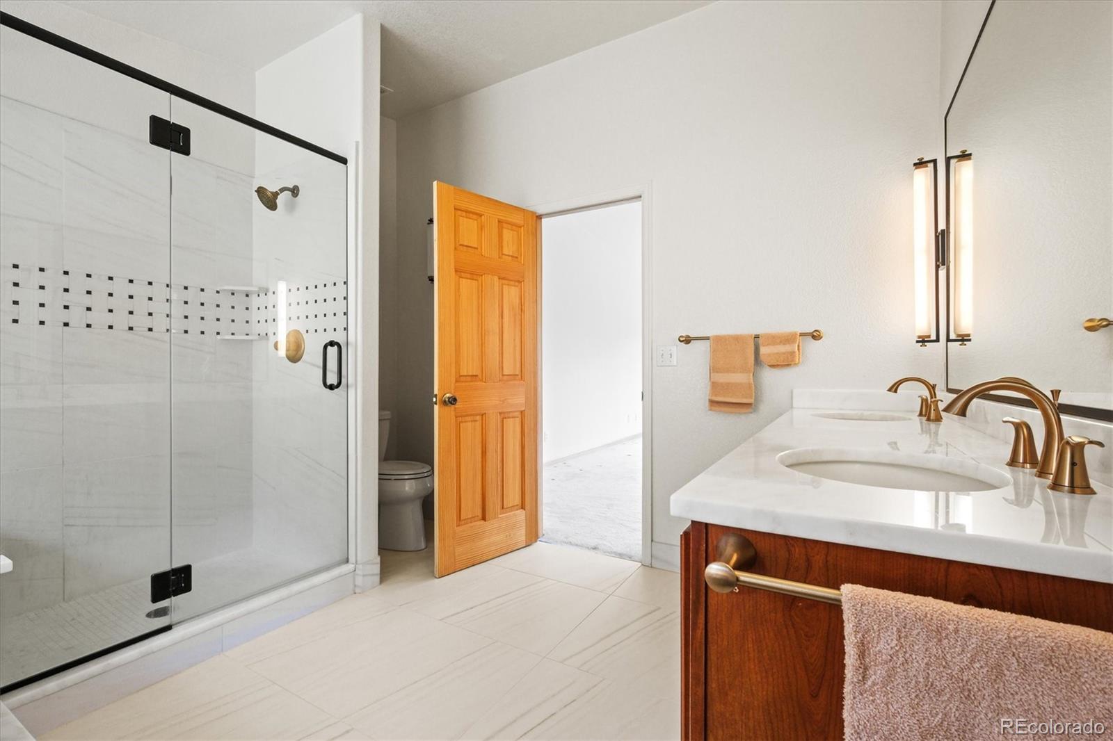 349 Royal Ridge Drive Bailey, CO 80421 - Photo 23 of 45 a bathroom with a sink and a shower