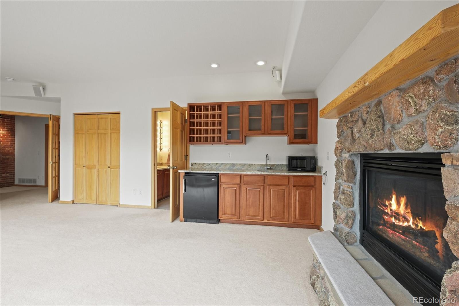 349 Royal Ridge Drive Bailey, CO 80421 - Photo 32 of 45 a kitchen with stainless steel appliances granite countertop a stove and a refrigerator