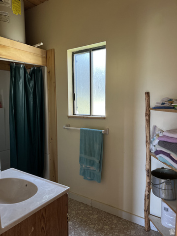 123 Tbd Monroe Canyon Road Monroe, UT 84754 - Photo 71 of 80 Bathroom with vanity, a shower with shower curtain, tile patterned floors, and electric water heater