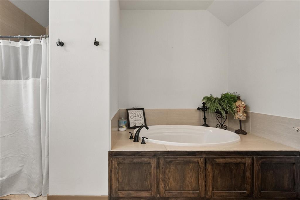 707 Phillips Court Mansfield, TX 76063 - Photo 17 of 28 a bathroom with a sink and a mirror