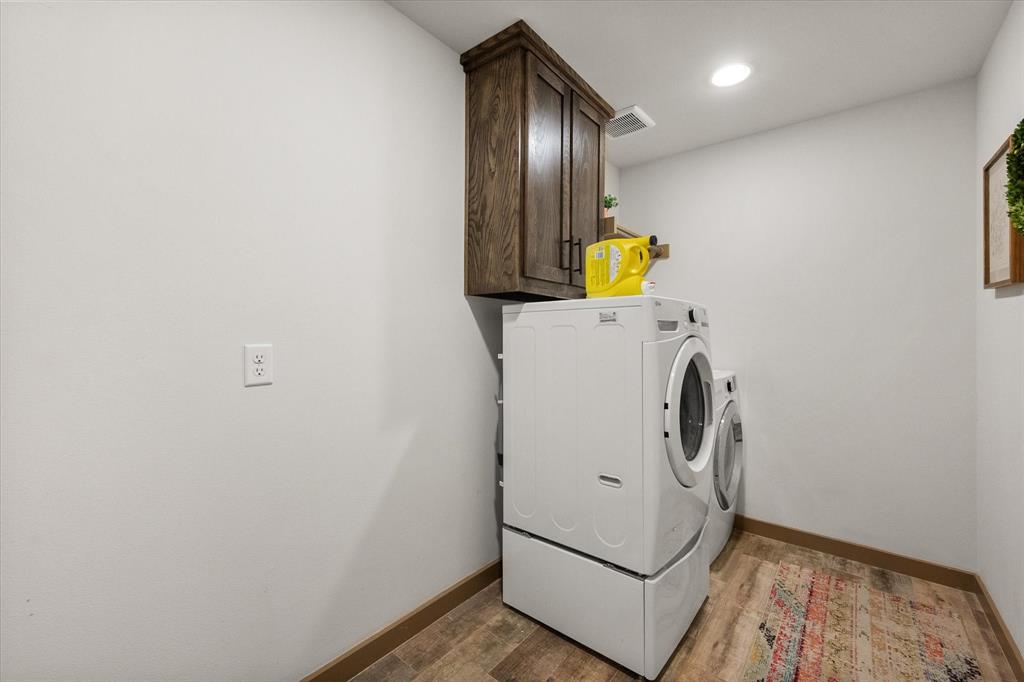 707 Phillips Court Mansfield, TX 76063 - Photo 27 of 28 a utility room with dryer and washer