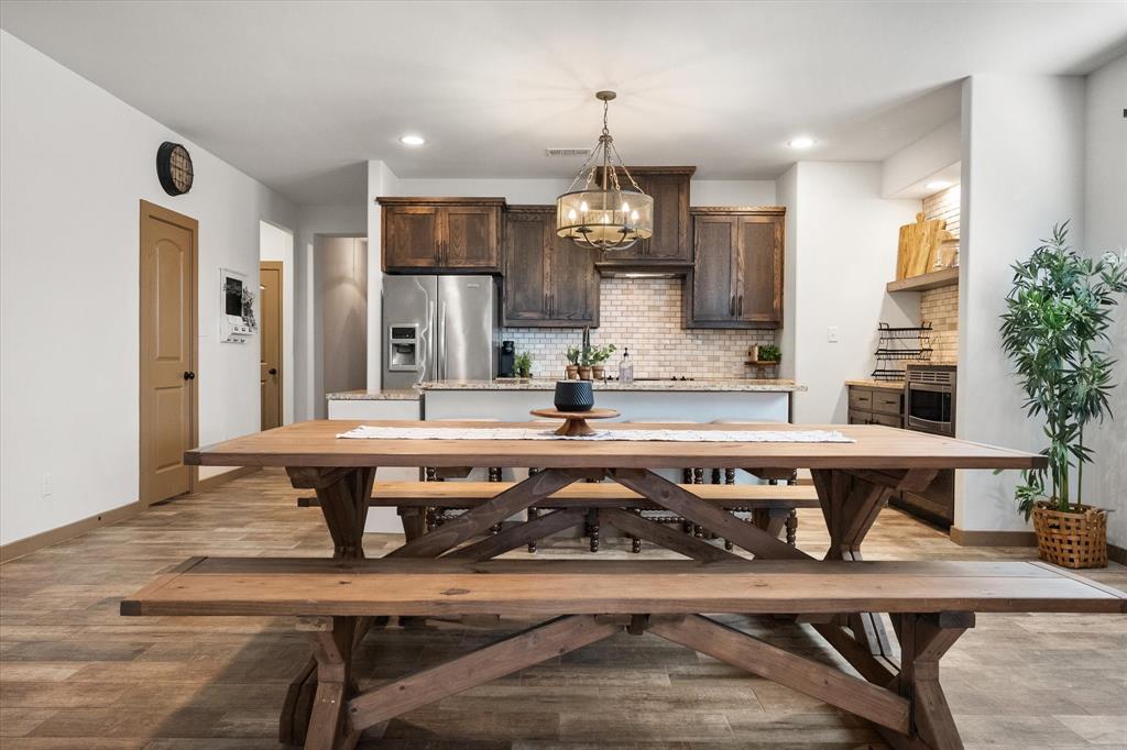 707 Phillips Court Mansfield, TX 76063 - Photo 4 of 28 a very nice looking dining room with a table and chairs