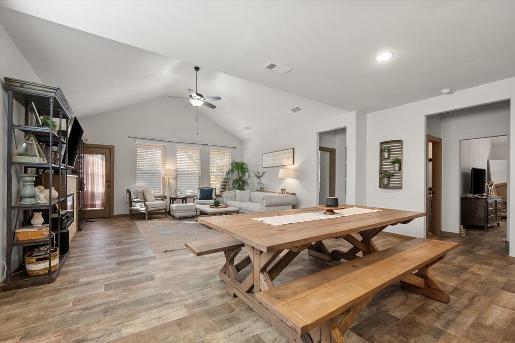 707 Phillips Court Mansfield, TX 76063 - Photo 8 of 28 a living room with furniture a table and bookshelf