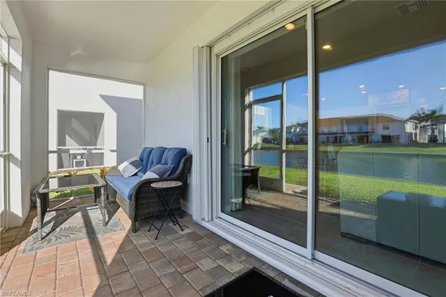 a building outdoor space with patio furniture and garden view