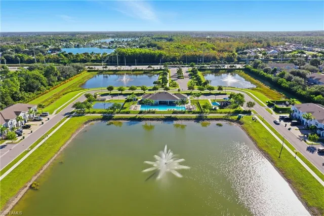 an aerial view of a house with a lake view