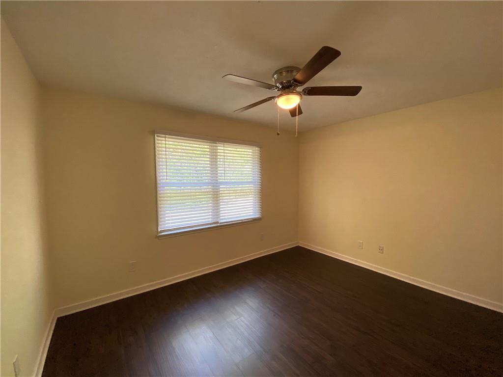 1981 Patterson Circle Lawrenceville, GA 30044 - Photo 12 of 19 a view of an empty room with wooden floor and a window