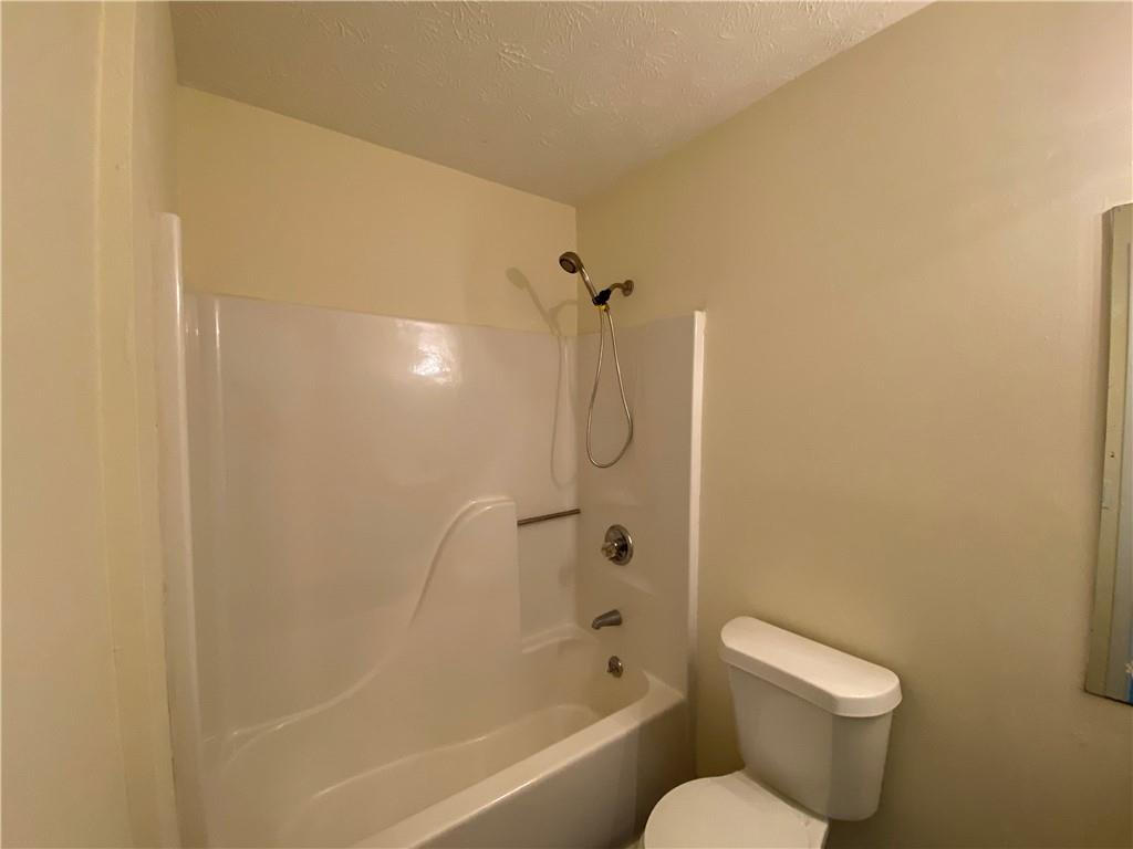 1981 Patterson Circle Lawrenceville, GA 30044 - Photo 14 of 19 a bathroom with a toilet and a shower