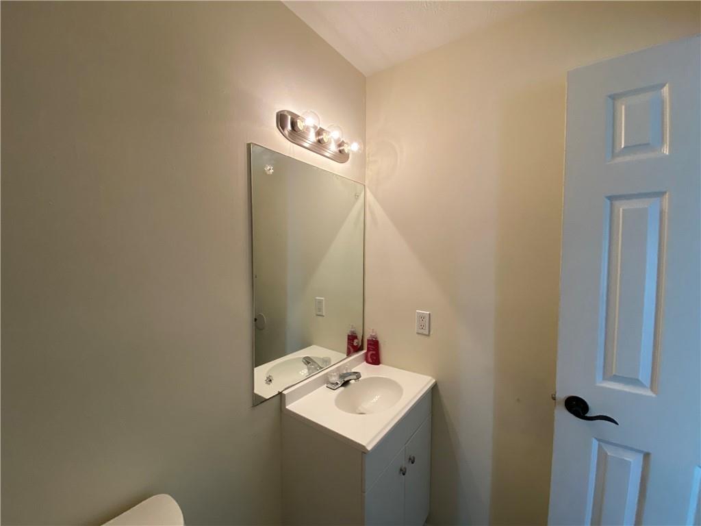 1981 Patterson Circle Lawrenceville, GA 30044 - Photo 15 of 19 a bathroom with a sink vanity and a mirror