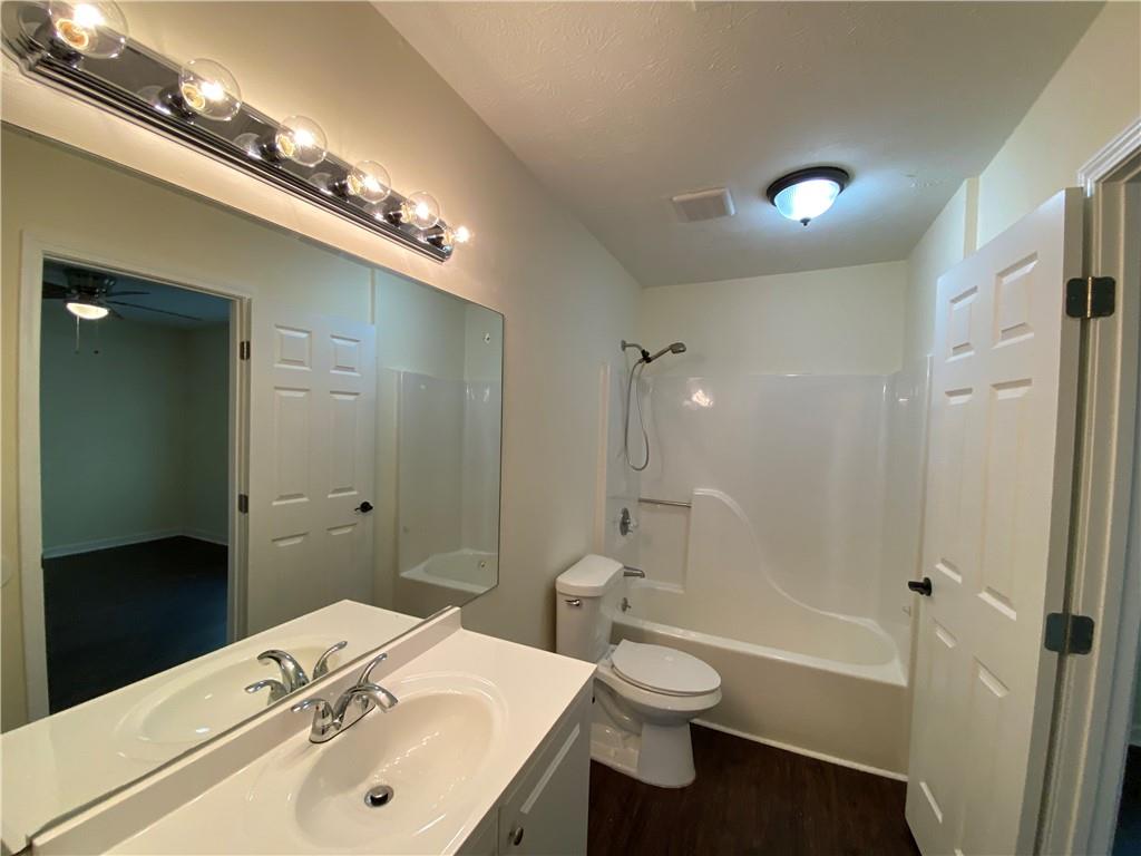 1981 Patterson Circle Lawrenceville, GA 30044 - Photo 8 of 19 a bathroom with a sink a toilet and shower