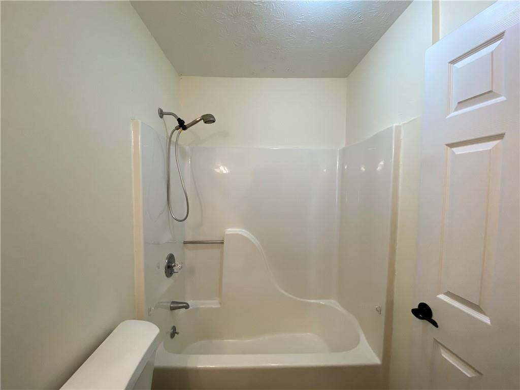 1981 Patterson Circle Lawrenceville, GA 30044 - Photo 9 of 19 a bathroom with a tub and a shower