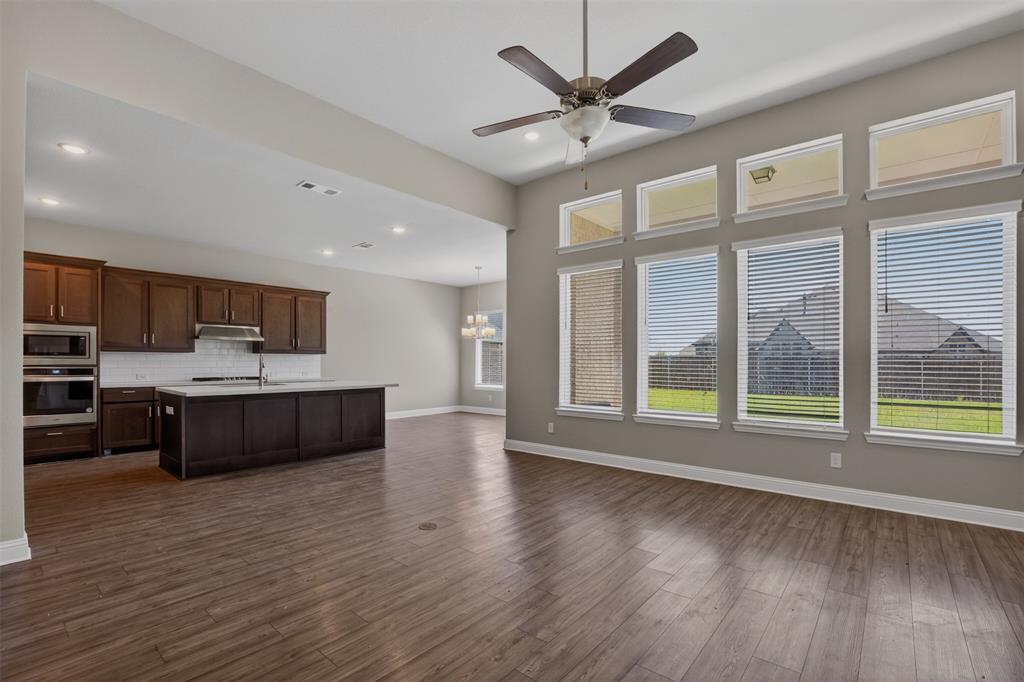 16812 Bitterroot Road Justin, TX 76247 - Photo 15 of 27 a large white kitchen with a large window a oven and a counter space