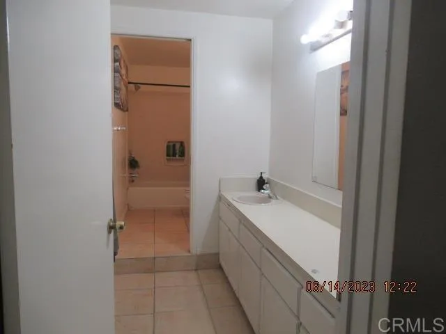 a bathroom with a bathtub and a sink