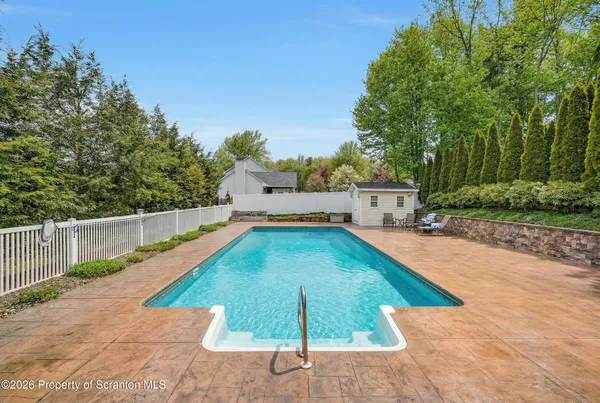 a living room with furniture ceiling fan and a rug