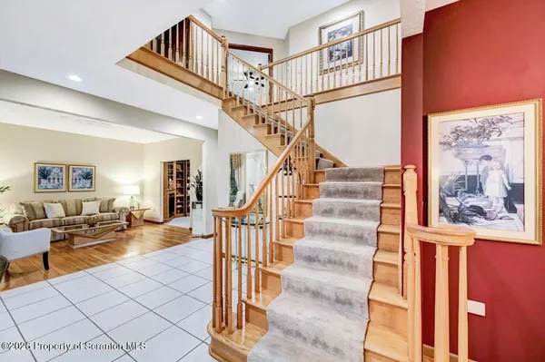 a dining room filled with furniture and window