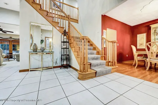 a kitchen with a refrigerator a oven a sink and a dining table