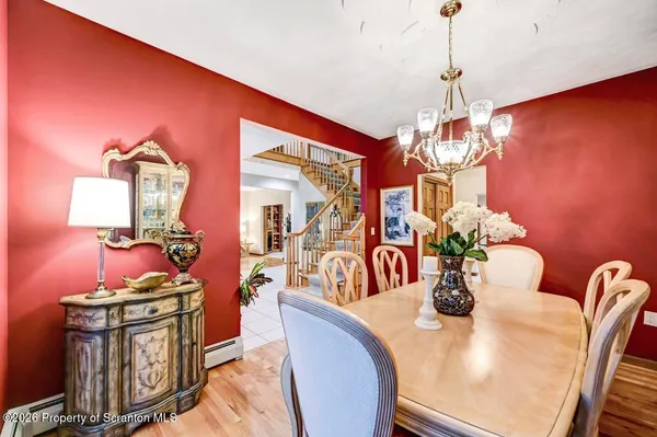 a spacious bedroom with a bed and ceiling fan