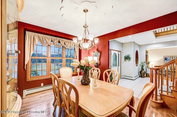 a view of a livingroom with workspace and a window