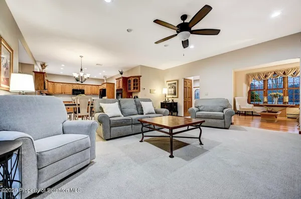 a bedroom with a bed and a large mirror