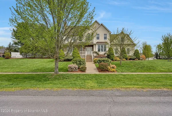a view of balcony with outdoor seating and wooden floor