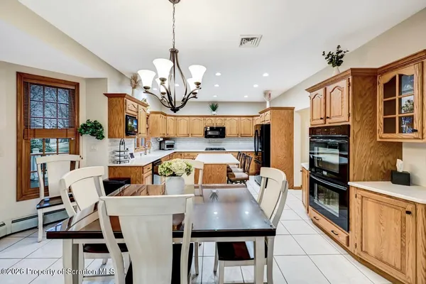 a white car parked in front of a building