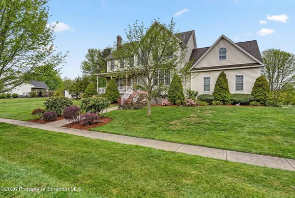 a view of a chairs and table in the balcony